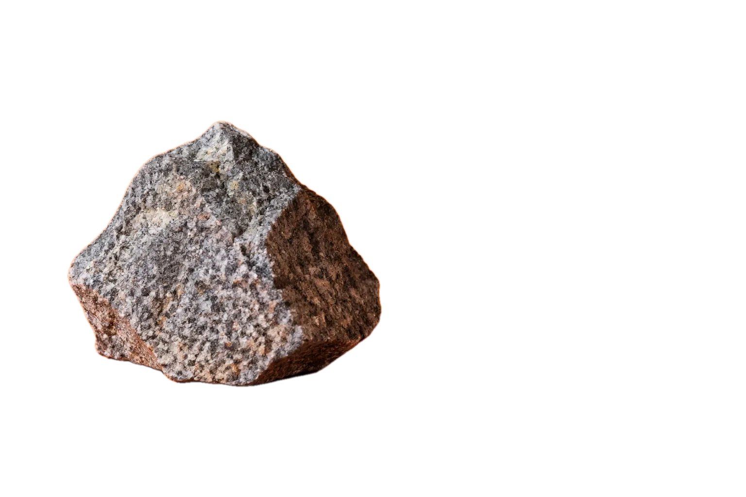 One grey stone on a tangerine studio backdrop